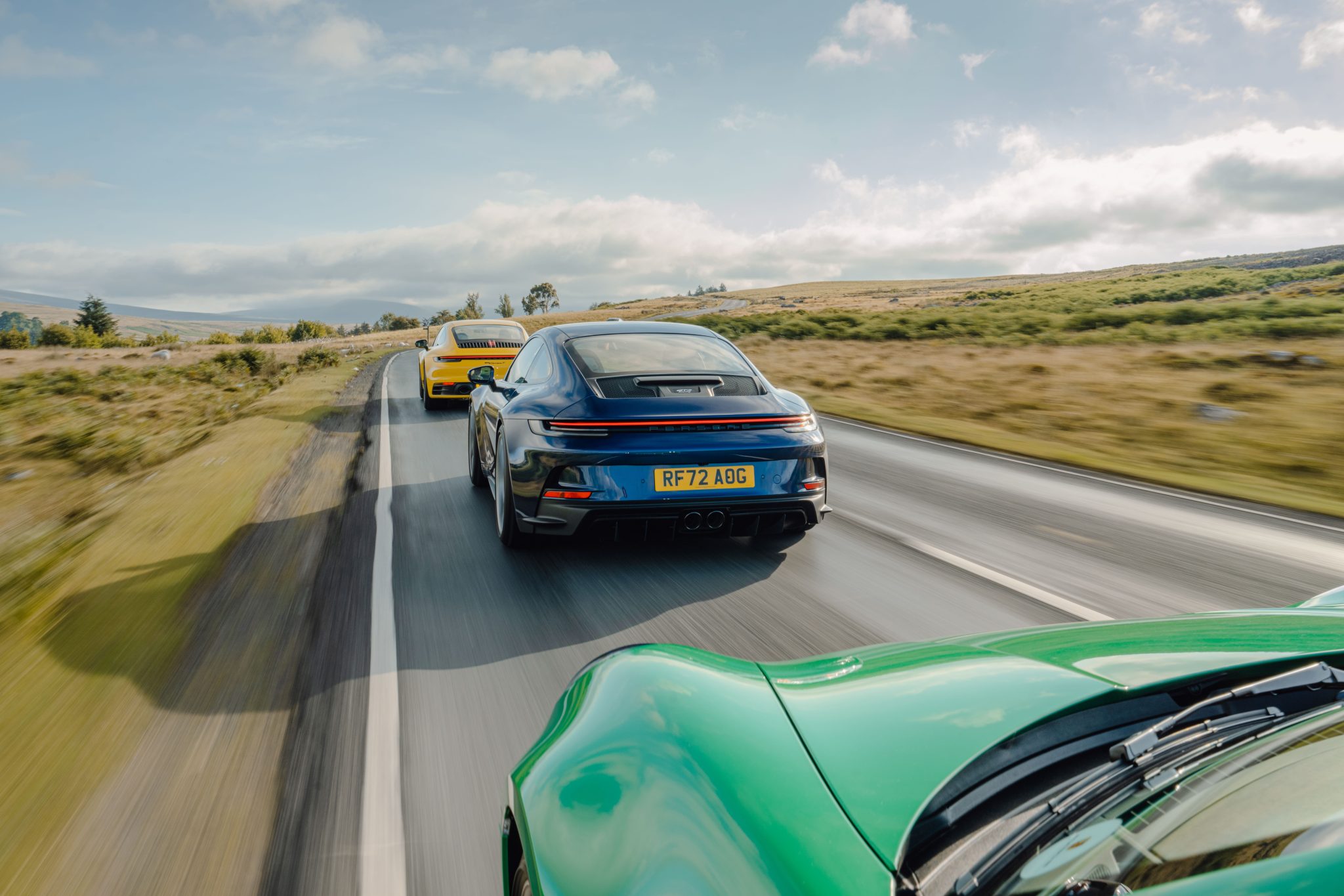 Speed Yellow Porsche 911 Carrera T, Python Green Porsche 911 GTS and Gentian Blue Porsche 911 GT3
