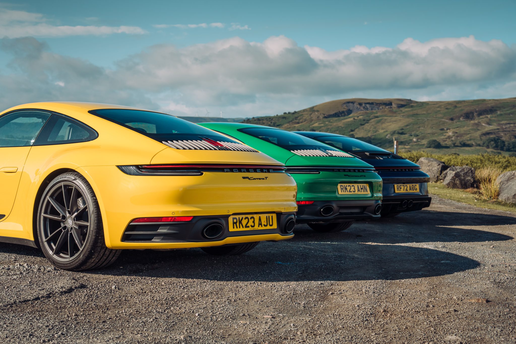 Speed Yellow Porsche 911 Carrera T, Python Green Porsche 911 GTS and Gentian Blue Porsche 911 GT3